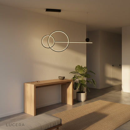 Brumal pendant light above kitchen island with iron rings and subtle reflection