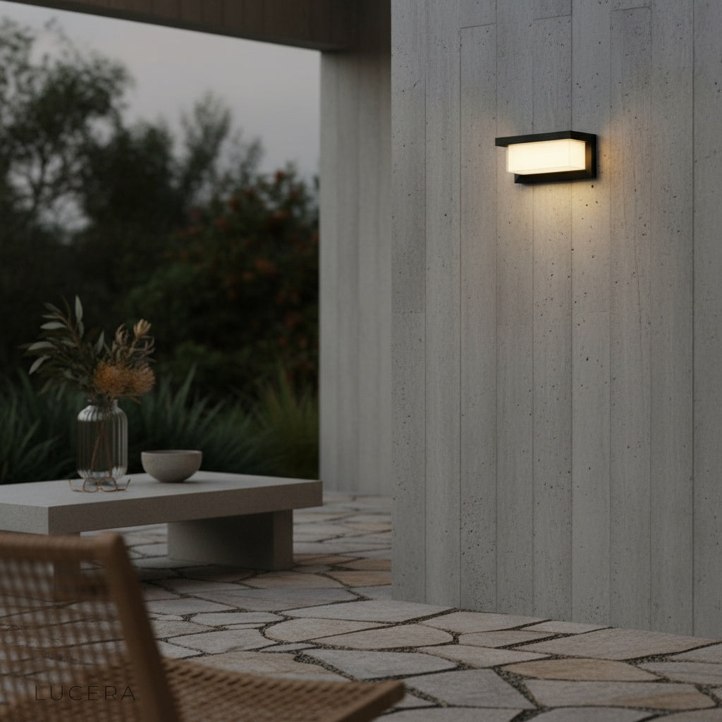 black Leonora wall sconce side profile showing sleek rectangular LED housing