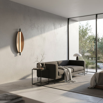 Studio shot of Rise sconce angled view showing diffused light panel and metal bracket