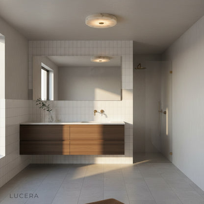 Yolande alabaster pendant illuminating minimalist dining area with warm glow