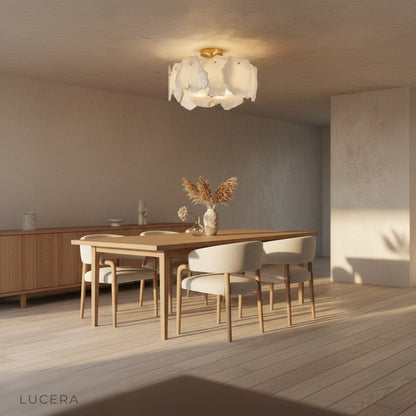 Fulgurant ceiling light with warm copper accents against dark wall for contrast