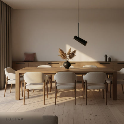 Bistre single pendant light glowing warmly in cozy bedroom corner at evening ambient light