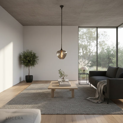 Livid Pendant Light in modern dining room casting ambient light over wooden table