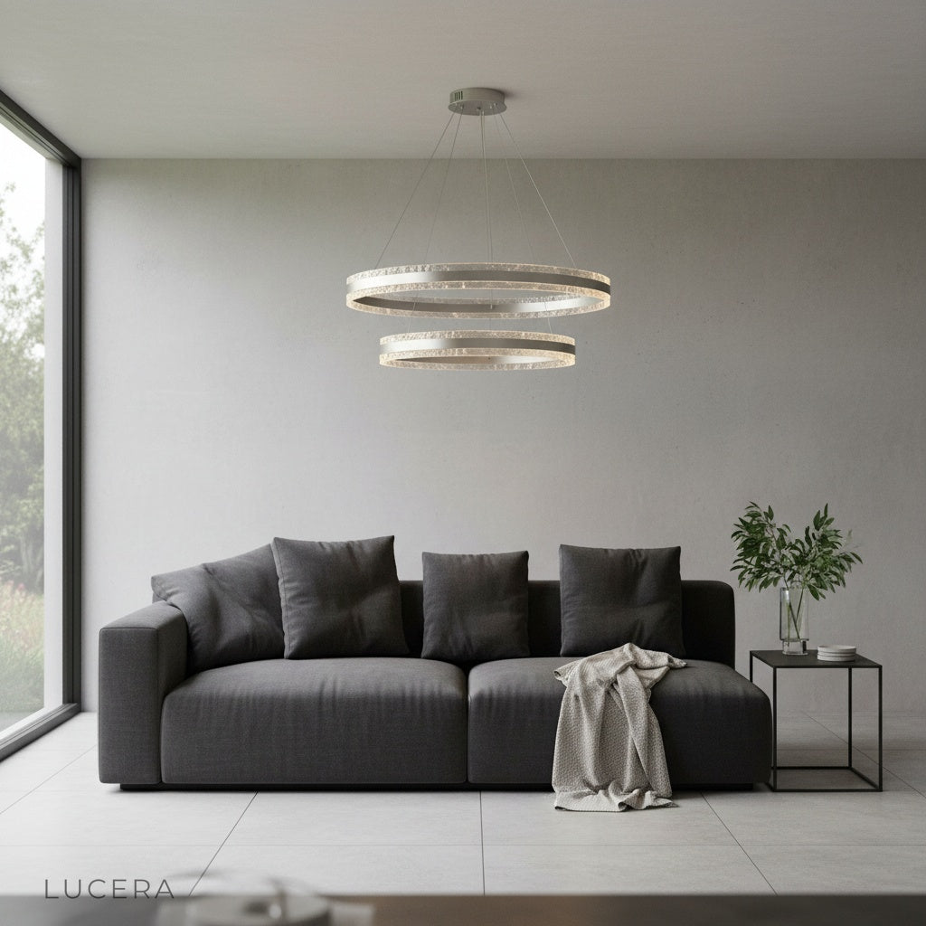 Bacchus Round Chandelier at dusk with ambient lighting casting soft shadows on walls