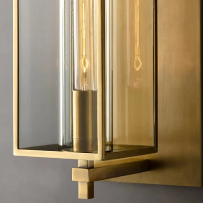 Close-up of the brass wall lamp arm and glass shade showing the retro American design