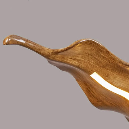 warm 3000K LED glow from leaf-shaped pendant chandelier in cozy dining space
