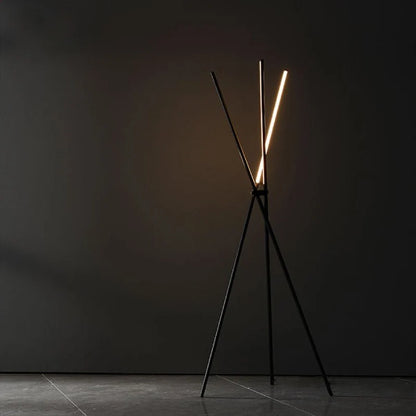 close-up of black tripod base joints on Iolite LED floor lamp showing premium aluminum finish