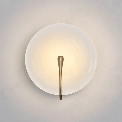 white marble lens wall lamp glowing in modern living room