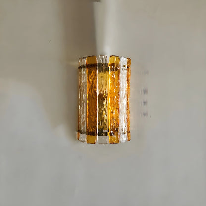 Pair of retro French brass wall lamps flanking a mirror in elegant hallway