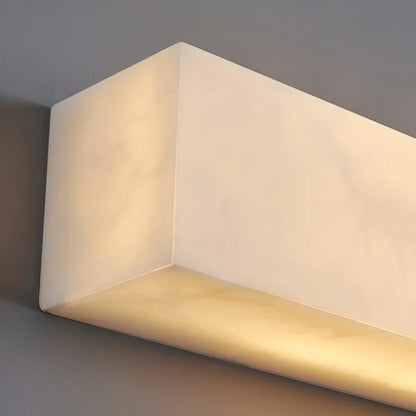 Close-up of the marble and copper detail on the Enjoue postmodern wall light