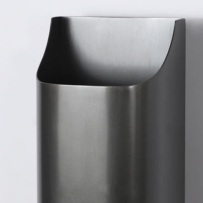 Close-up of Vivace wall lamp brass texture and matte black shade detail, showing premium craftsmanship