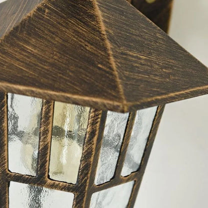 close-up of Portia lamp tempered glass panel revealing warm E27 bulb glow