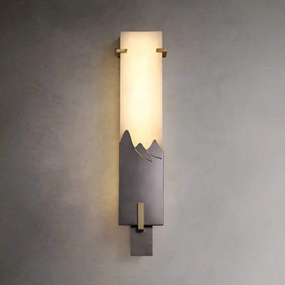 Clean white background studio view of antique style marble wall sconce with warm 3000K light