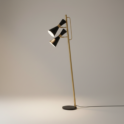 Minimalist aluminum and iron floor lamp standing upright against a clean white studio backdrop