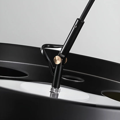 side profile of curved aluminum arc floor lamp showing sleek matte finish