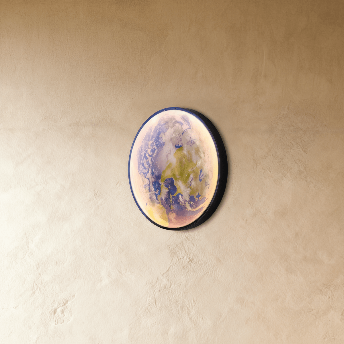 Caspian Moon Wall Lamp in a contemporary office space above a sleek desk with subtle daylight