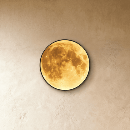 Caspian Moon Wall Lamp glowing at night in a dining room with dark walls and pendant lights
