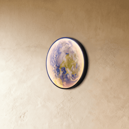 Caspian Moon Wall Lamp illuminated art in a nursery with a soft, dreamy glow and muted colors