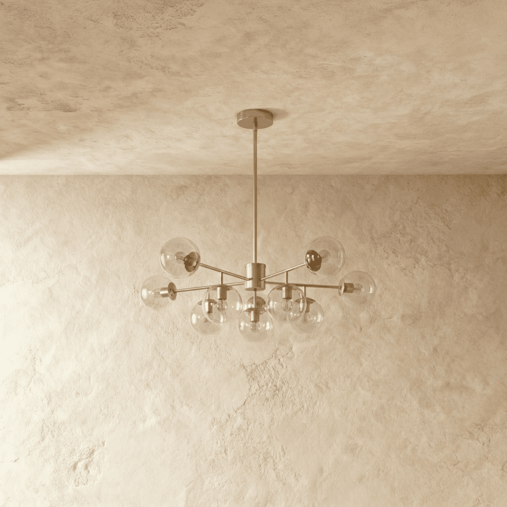 Yett chandelier front view with clear blown glass accents on neutral gray backdrop