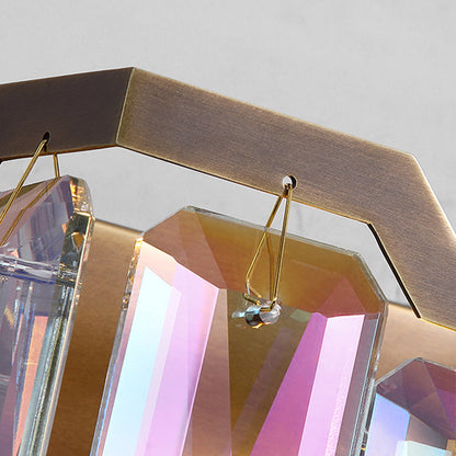 detail macro of colorful crystal prisms on Dono wall sconce casting rainbow light refractions