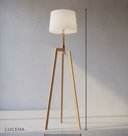 front view of solid wood floor lamp with round cloth lampshade on clean background