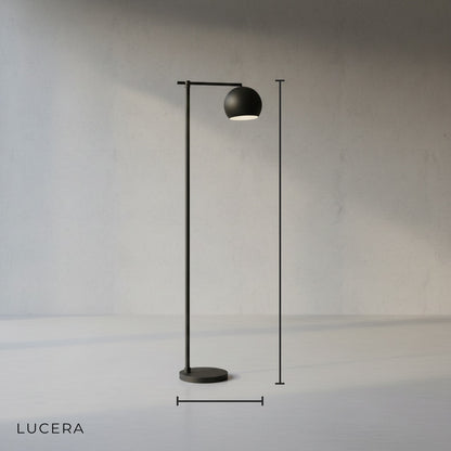 Sleek aluminum and iron floor lamp with adjustable reading head in studio lighting