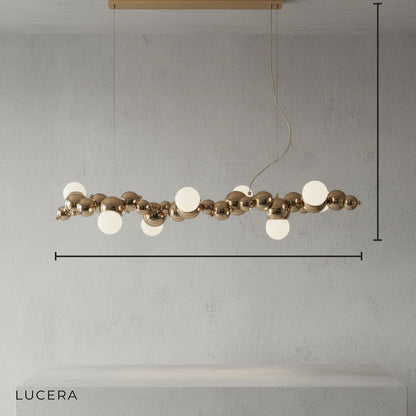 front view of brushed nickel bubble chandelier hanging centered in minimalist studio setting