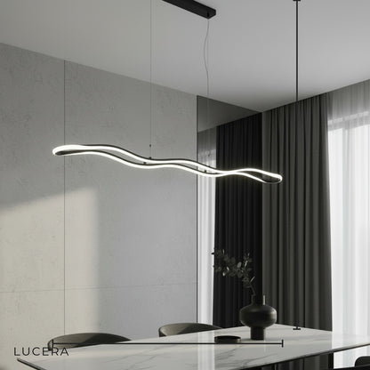 minimalist studio view of Skadi Wave pendant light with flexible silicone diffuser