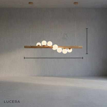 minimalist studio view of Svartr Nordic glass ball LED pendant light showing adjustable wire and wood grain