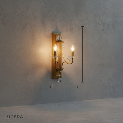 Silver finish candle-shaped wall sconce with crystal details, front view studio lighting