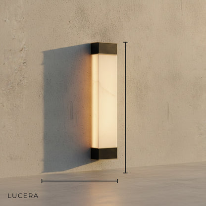 minimalist Marco wall lamp with white marble shade and copper accents studio view
