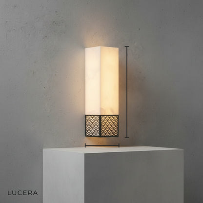 Black finish Astragal marble wall lamp front view in minimalist studio setting