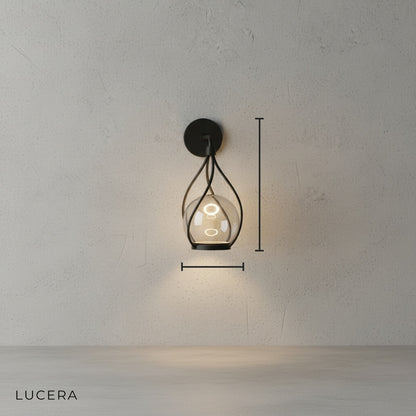front view of Lucera Tenuto LED sconce with warm 3000K light