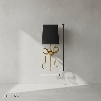 Studio shot of Mute Retro LED copper wall light with black fabric shade on clean background