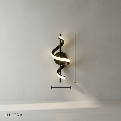 Crescendo creative LED wall sconce gold finish studio shot side angle against white wall