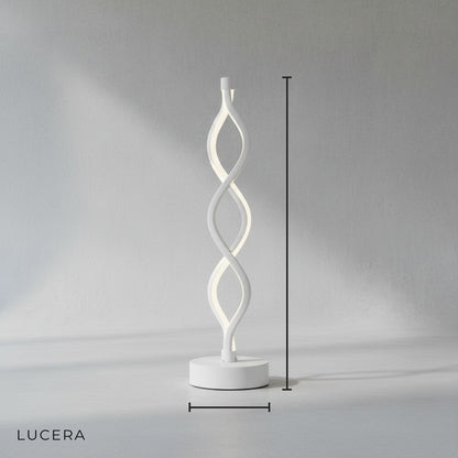 Minimalistic spiral aluminum table lamp on clean white studio background, front view