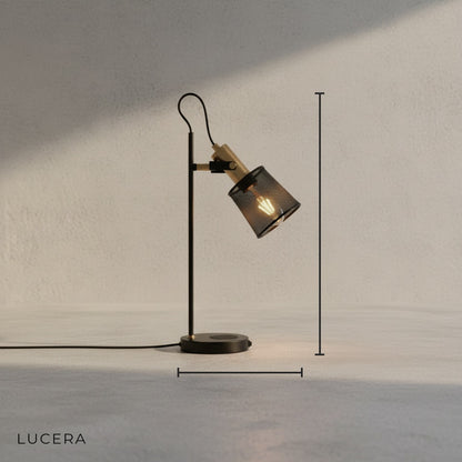 industrial black metal desk lamp with adjustable shade and built-in wireless charger studio shot