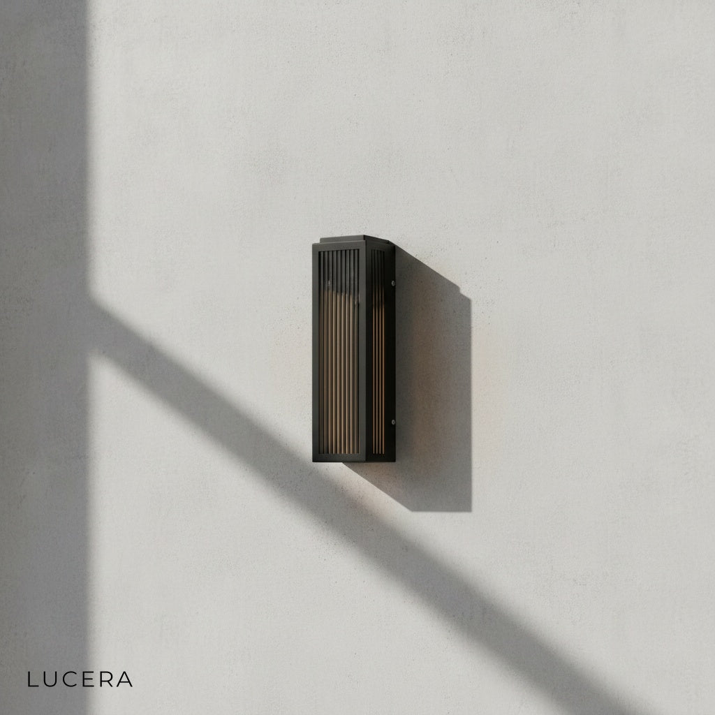 IP54 rated outdoor wall light mounted on brick wall with soft evening light