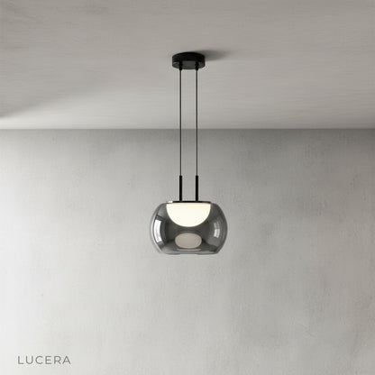 Ribbed glass shade and sleek iron frame of Gareth pendant light, studio product shot