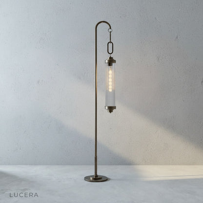 Sacrament Floor Lamp side profile showing curved brass rod and weighted base