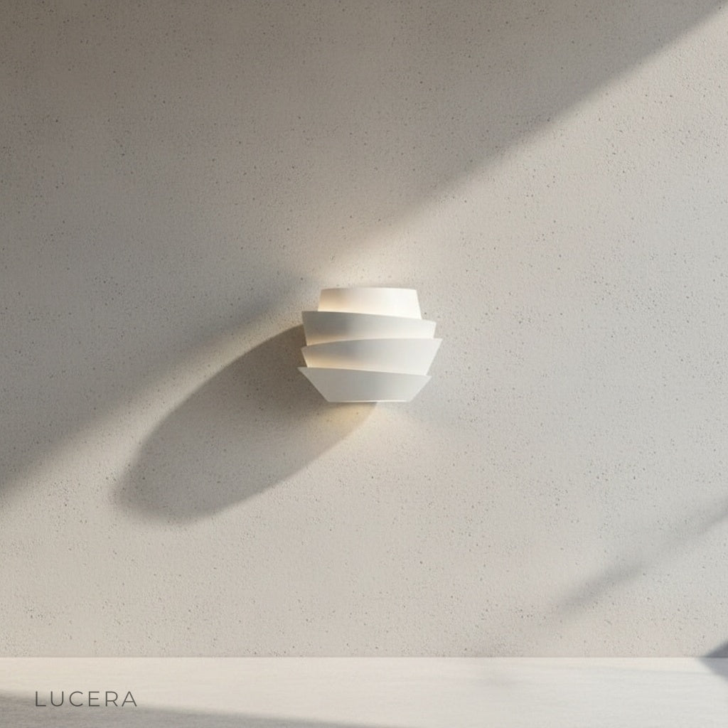 Close-up of Manor Wall Lamp showing sleek white finish and dual-bulb upward and downward light