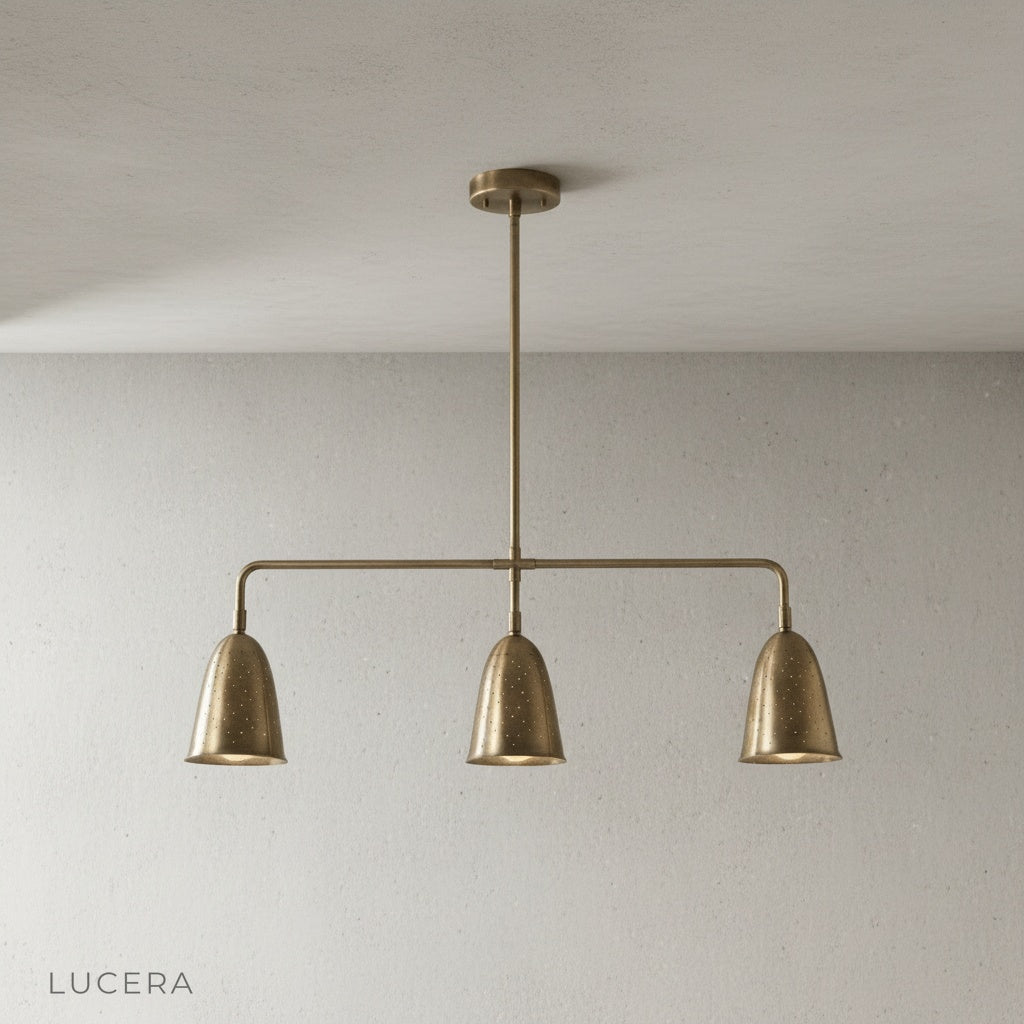 front view of solid brass linear chandelier with polished finish on clean white background