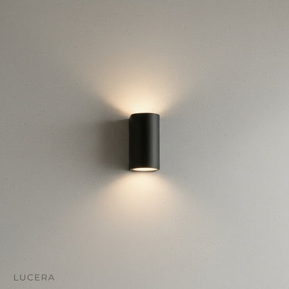 minimalist outdoor wall light with frosted glass panel against white background