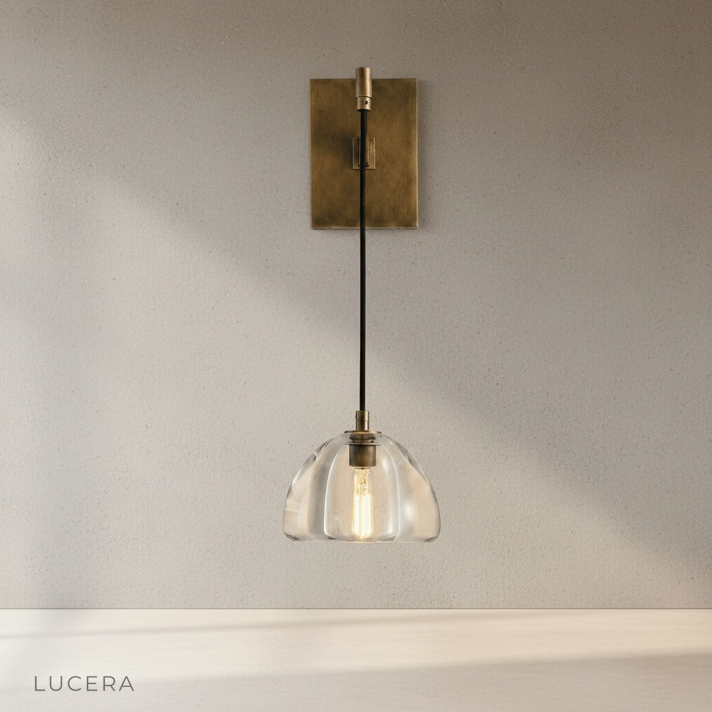 Zuleika Wall Lamp brass curved arm and rectangular base studio product shot