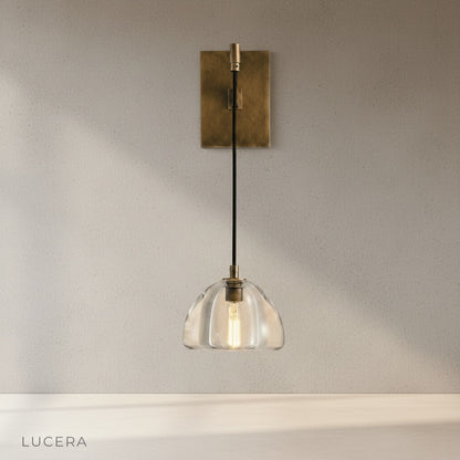 Zuleika Wall Lamp brass curved arm and rectangular base studio product shot