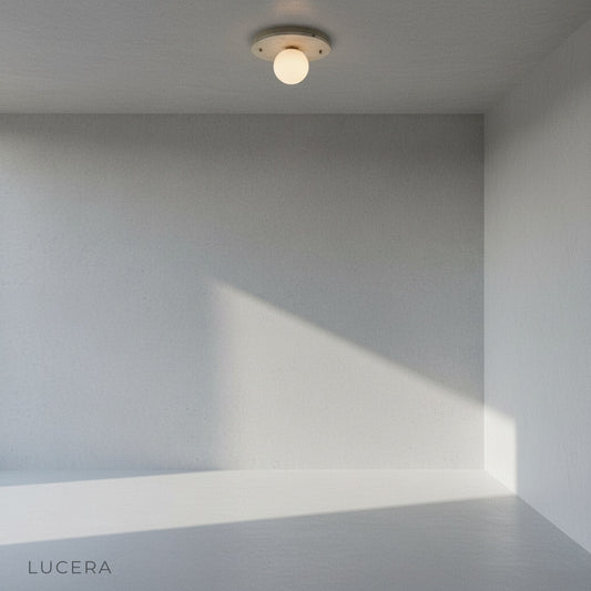 Studio shot of Bellatrix terrazzo ceiling light with spherical glass shade on clean white background
