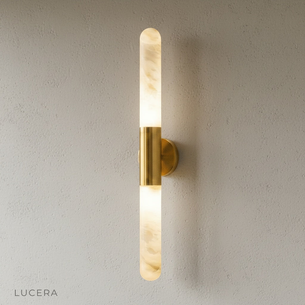 vertical wall lamp with copper finish and alabaster glass on clean white studio background