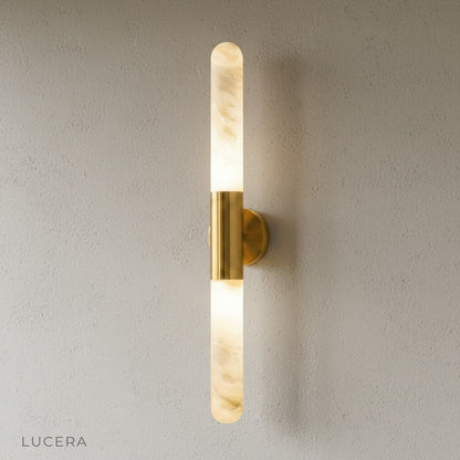 vertical wall lamp with copper finish and alabaster glass on clean white studio background