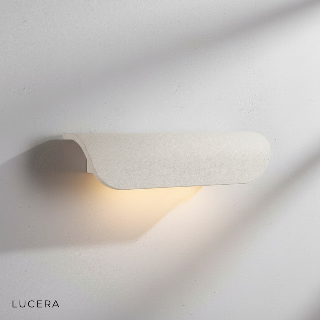 Vega wall light in matte black finish mounted on modern garden wall