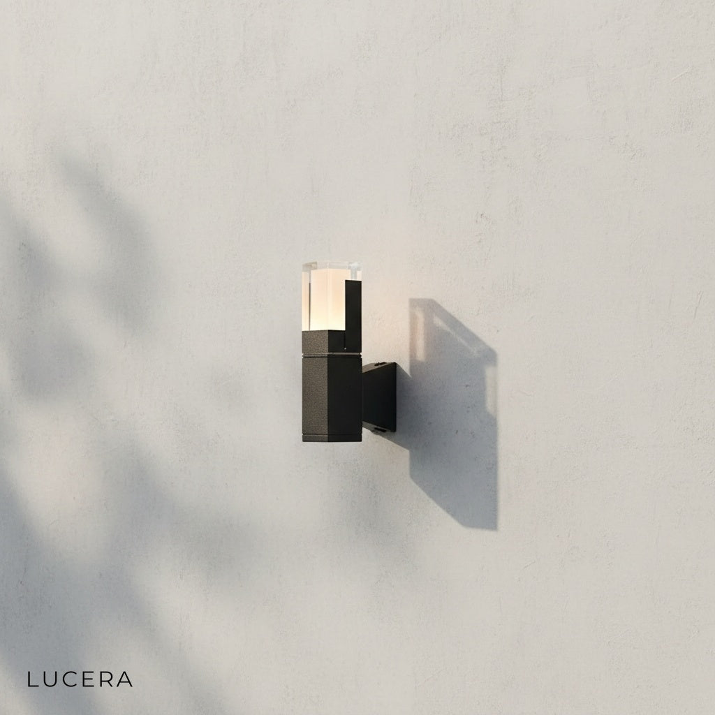 front view of Merle LED wall sconce mounted on clean white studio wall
